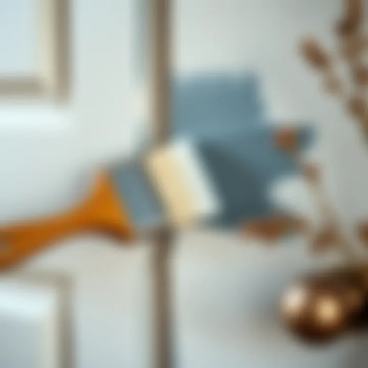 Close-up of a brush applying paint on a panel door