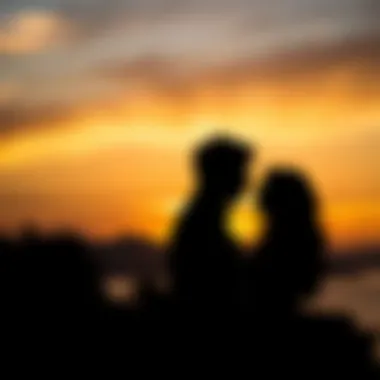 Silhouetted couple against a stunning sunset backdrop